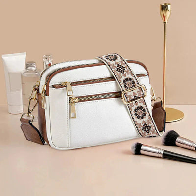 Arvida | Crossbody-veske med trykt stropp